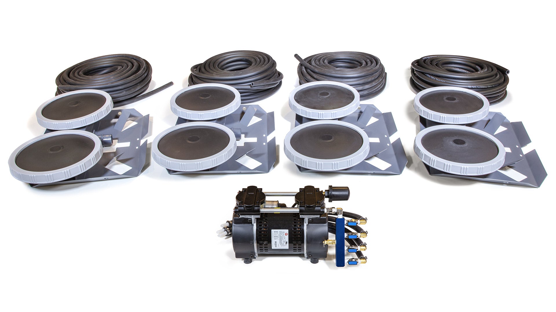 Collection of mechanical components including belts and pulleys on a white background
